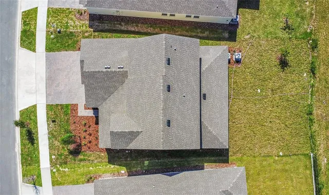 an aerial view of residential house with outdoor space and swimming pool