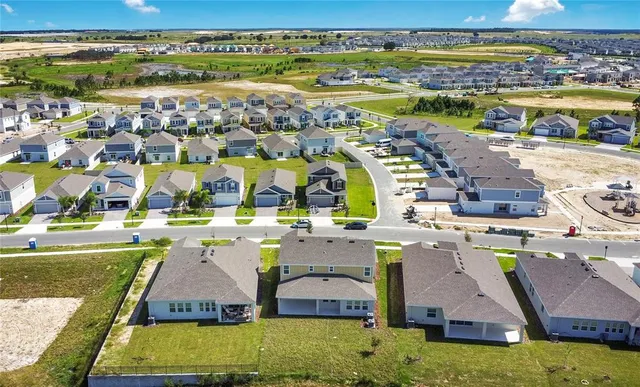 a view of a swimming pool with outdoor seating