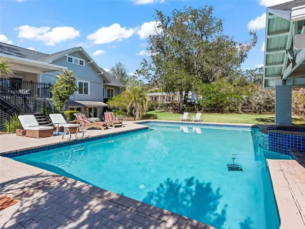 a view of a swimming pool with a patio