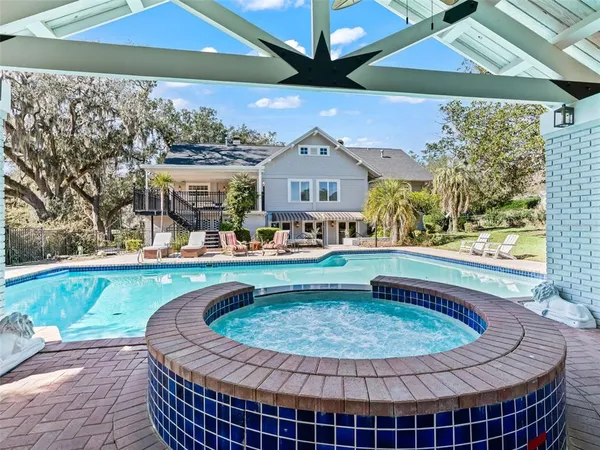 a view of a swimming pool with a patio