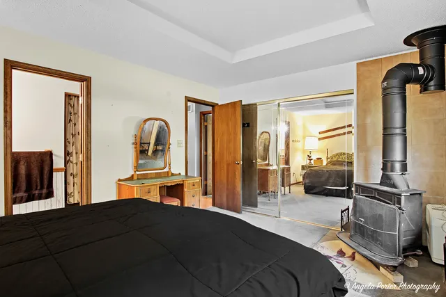 a bedroom with a bed and large cabinets