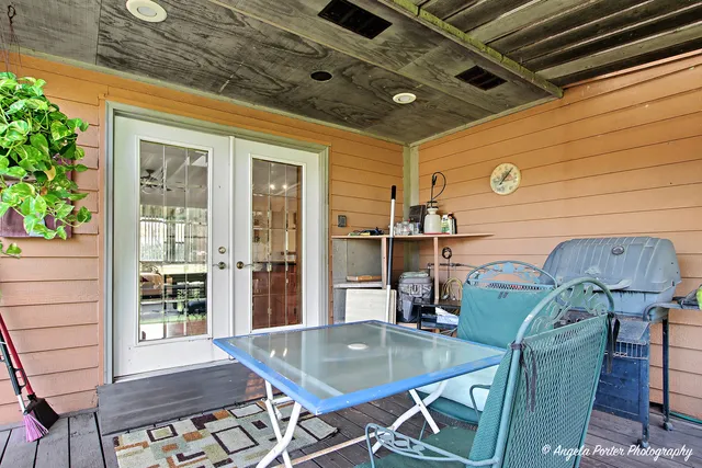 a dining room with furniture and wooden floor