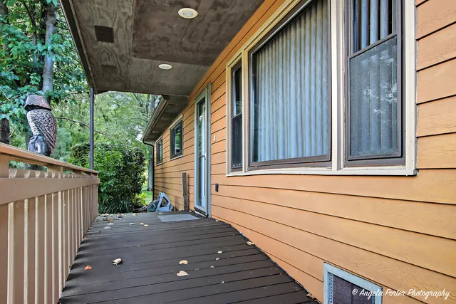 a view of house with backyard and garden