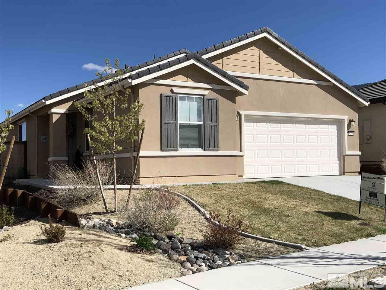 9236 Maplehurst Trail Reno, NV 89523 - Photo 1 of 25 a front view of a house with a yard