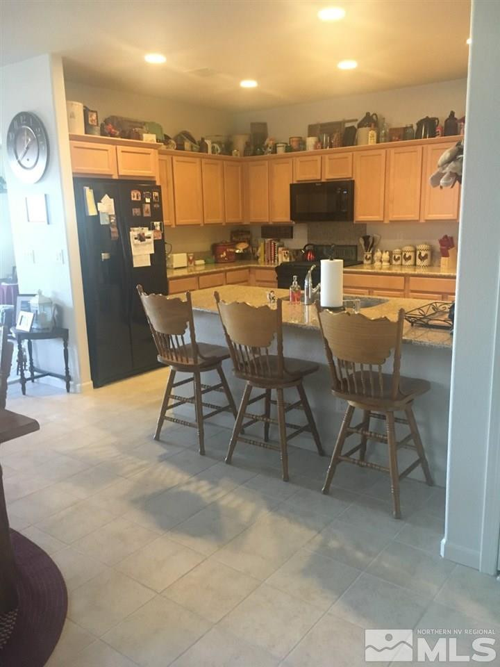 9236 Maplehurst Trail Reno, NV 89523 - Photo 13 of 25 a view of a dining room with furniture