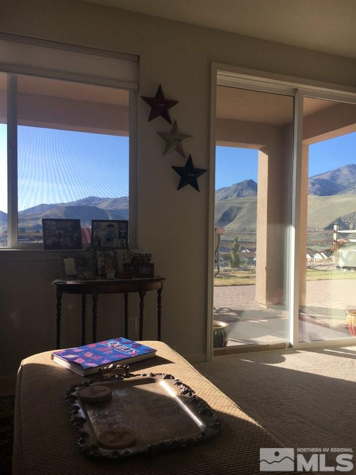 9236 Maplehurst Trail Reno, NV 89523 - Photo 19 of 25 a room with a bed and a window