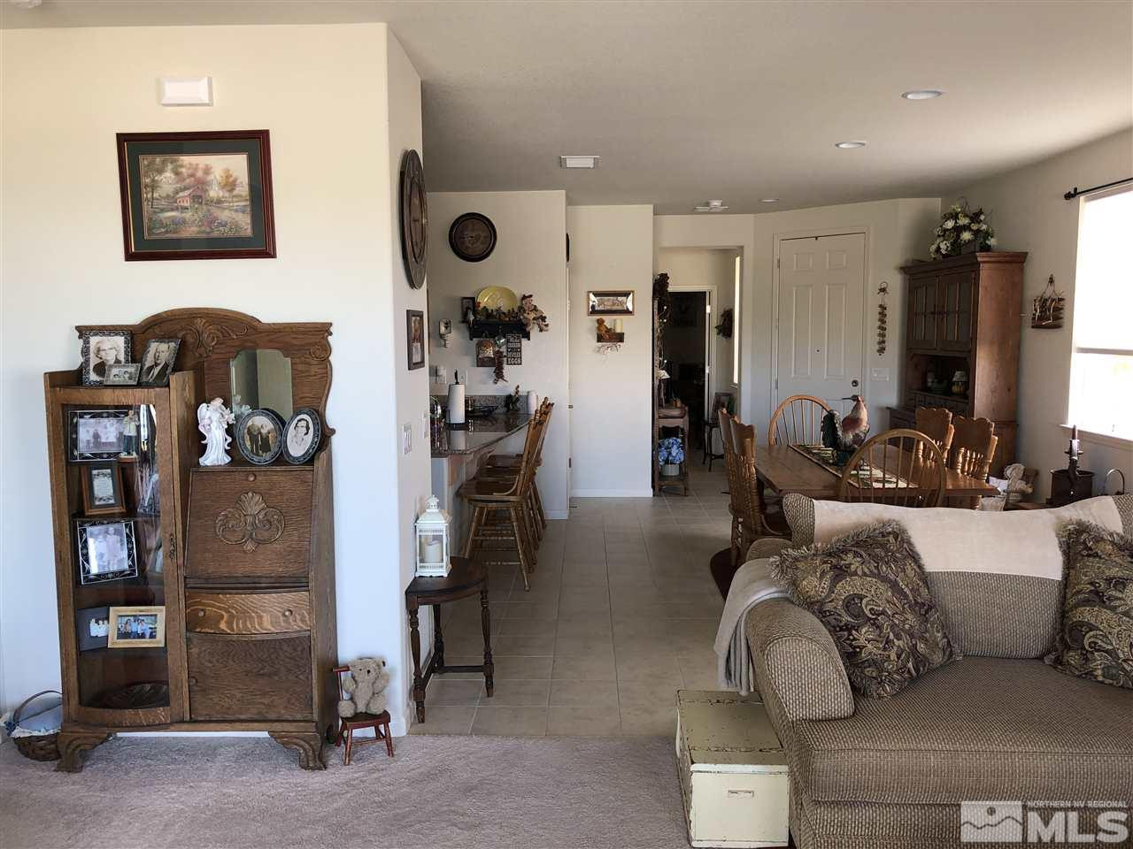 9236 Maplehurst Trail Reno, NV 89523 - Photo 20 of 25 a living room with furniture and a flat screen tv
