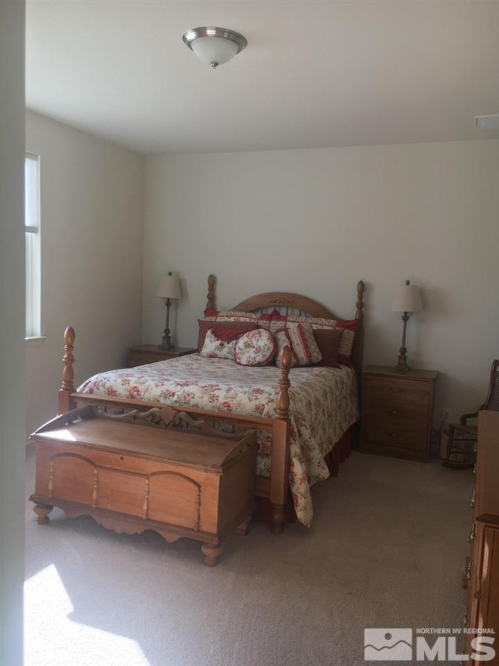9236 Maplehurst Trail Reno, NV 89523 - Photo 21 of 25 a bedroom with a bed and a table
