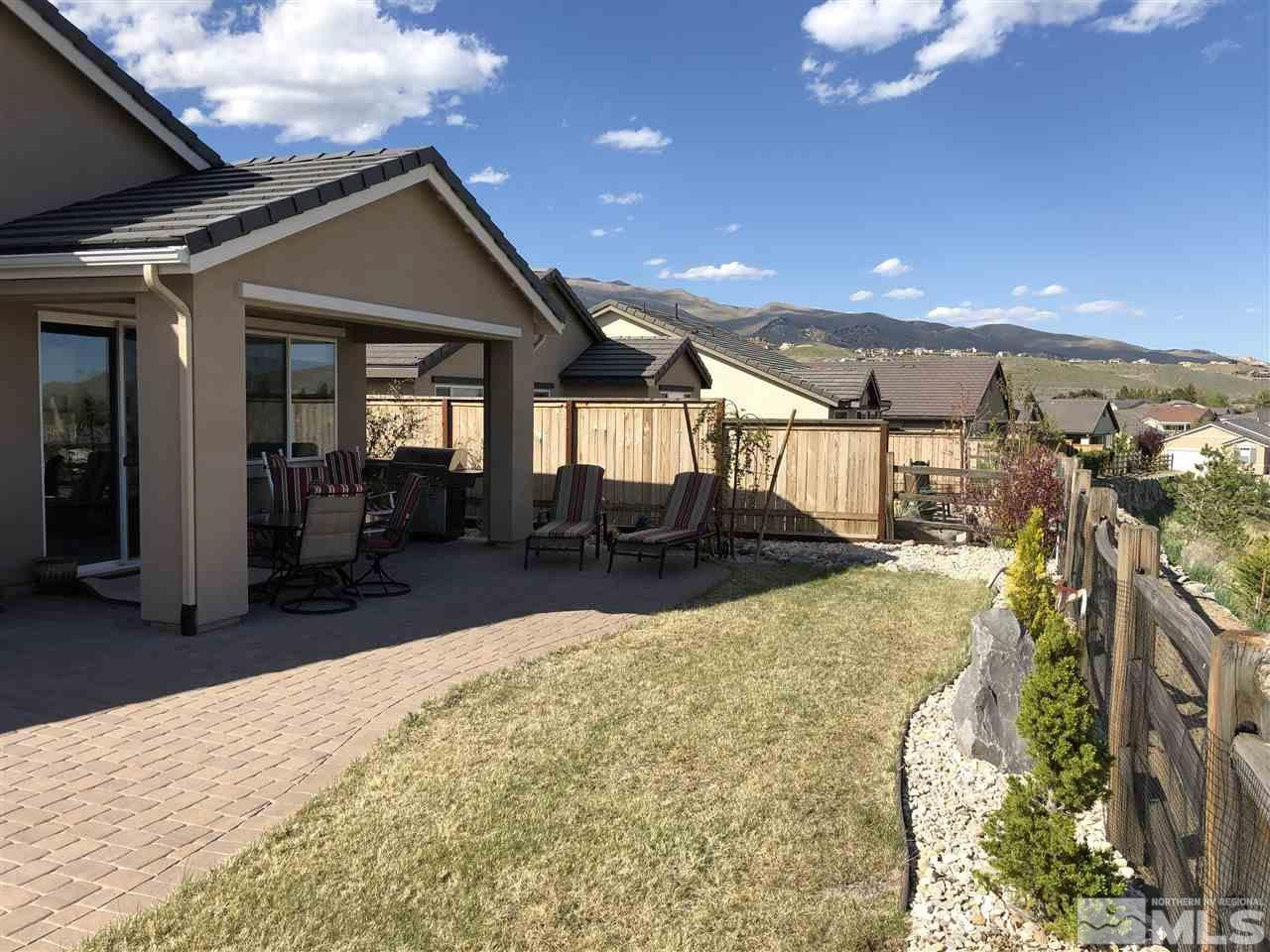 9236 Maplehurst Trail Reno, NV 89523 - Photo 4 of 25 a view of a patio with table and chairs with wooden floor