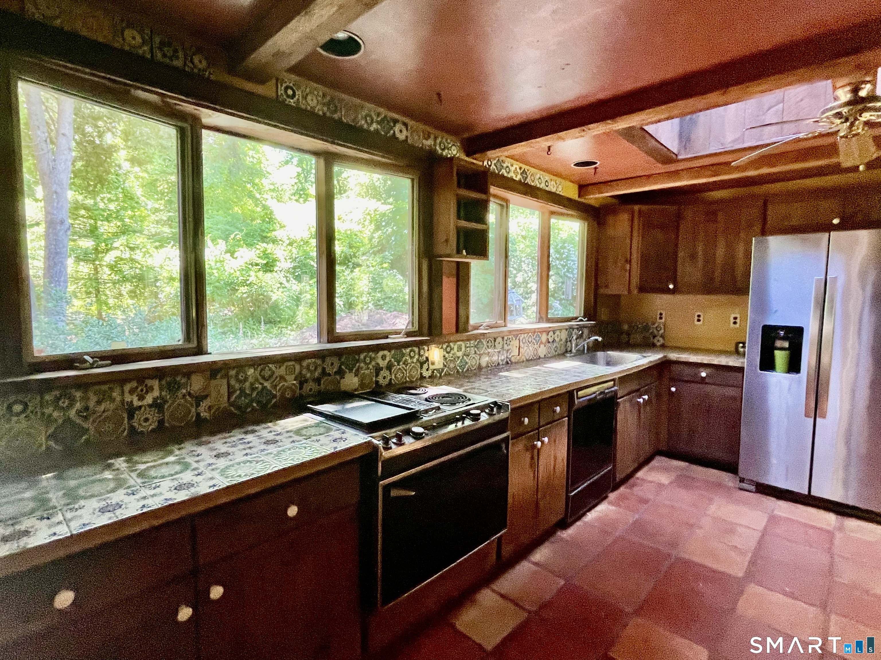 11 Tubbs Spring Drive Weston, CT 06883 - Photo 8 of 36 Kitchen overlooks the gardens from a wall of windows