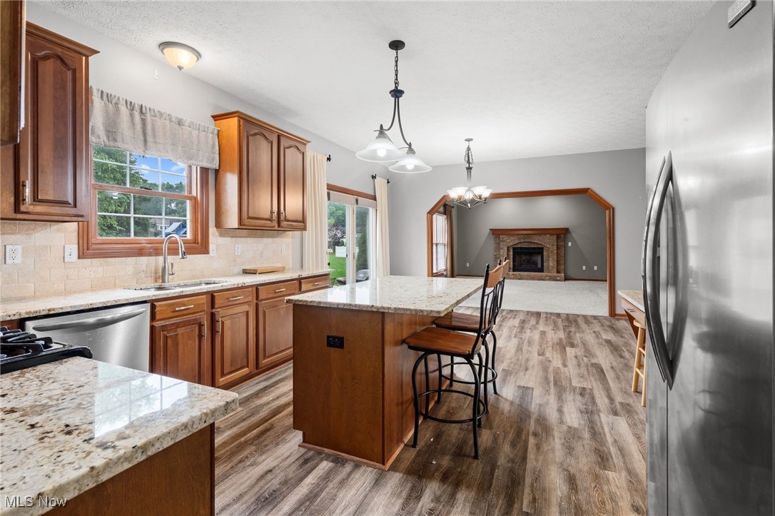 5700 Birmingham Road Northeast Canton, OH 44721 - Photo 12 of 37 Eat-in kitchen is open to the family room w/electric fireplace