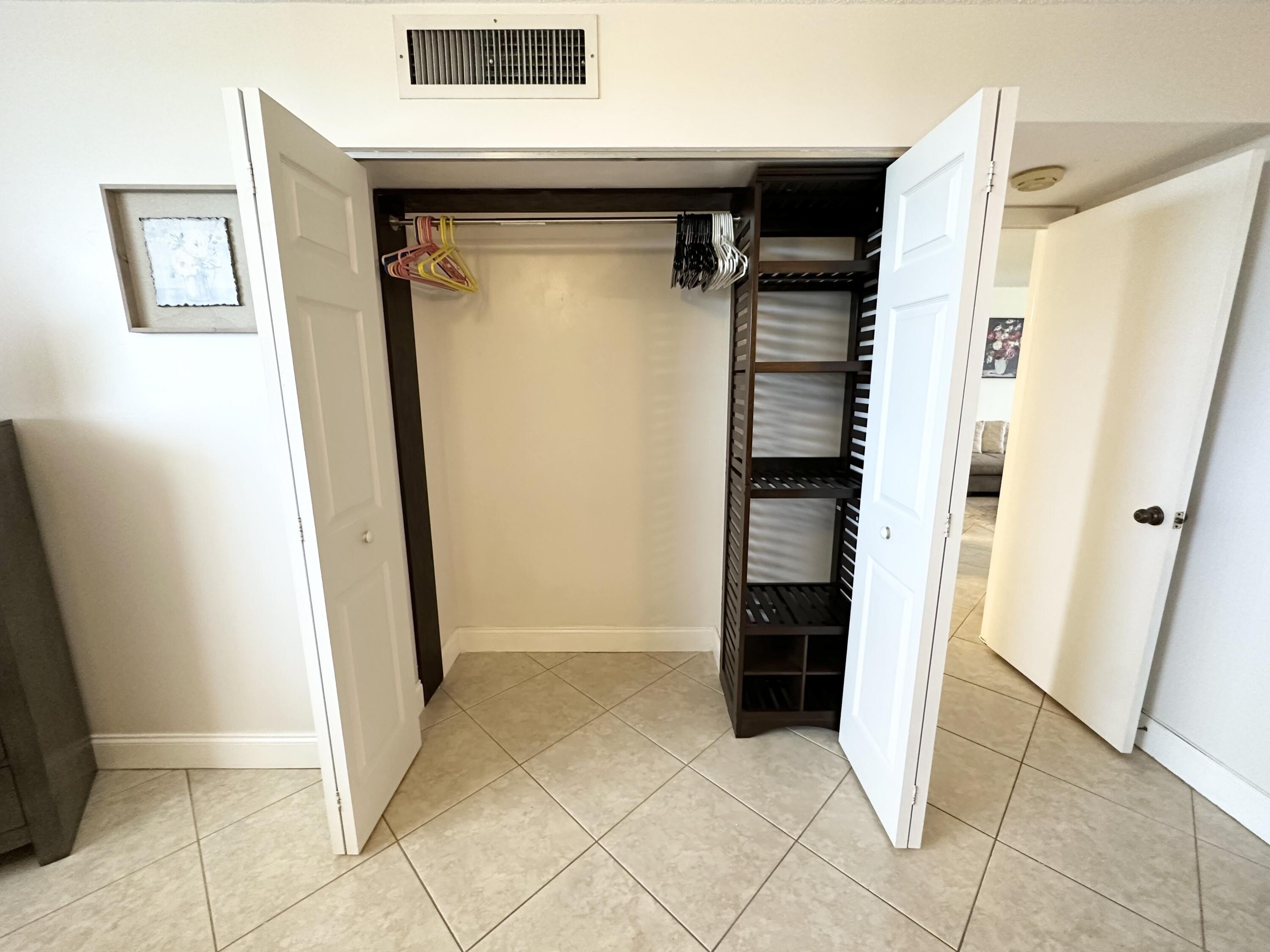 6161 Northwest 2nd Avenue, Unit 420 Boca Raton, FL 33487 - Photo 18 of 28 Master wardrobe closet