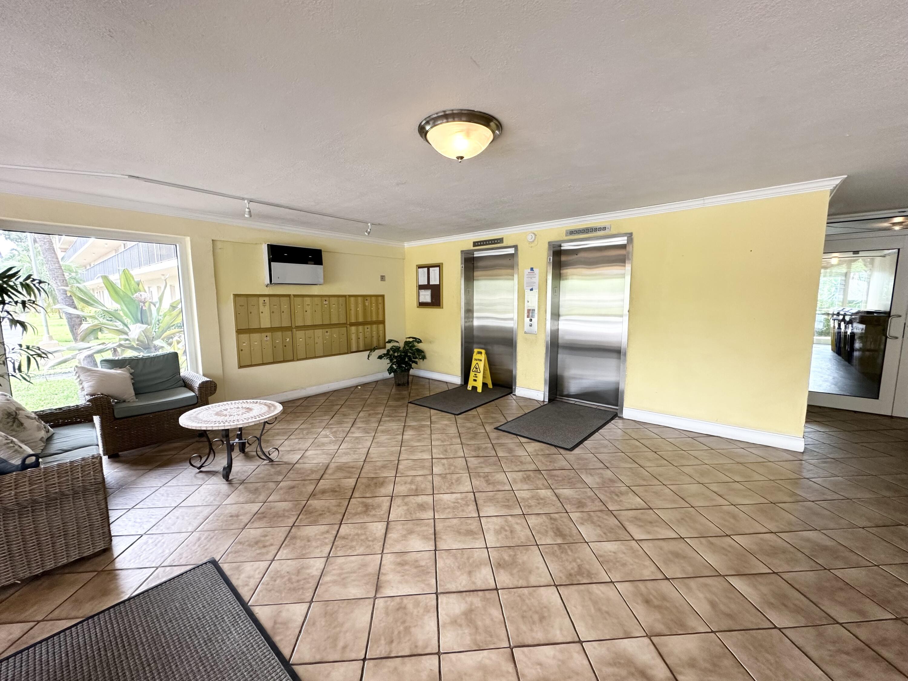 6161 Northwest 2nd Avenue, Unit 420 Boca Raton, FL 33487 - Photo 28 of 28 Lobby elevators