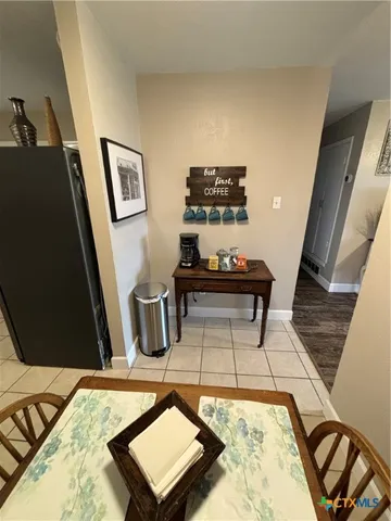 a bathroom with a granite countertop sink a toilet a mirror and vanity