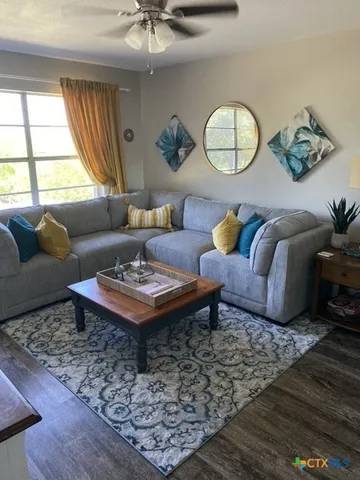 a living room with furniture and a window