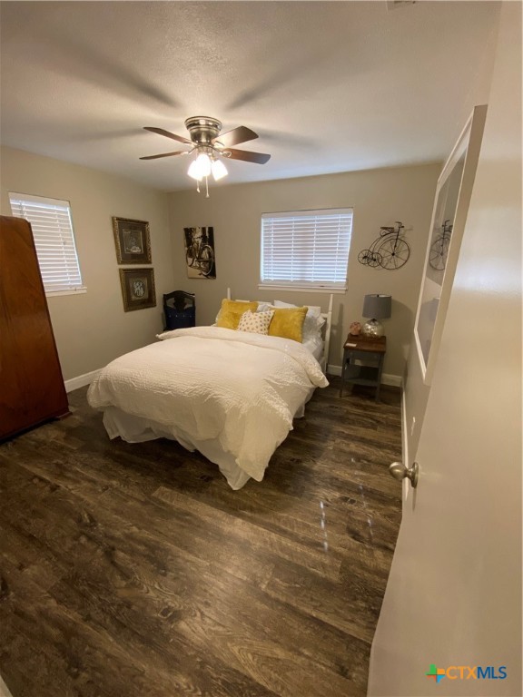 1307 Sherry Lane, Unit B Copperas Cove, TX 76522 - Photo 42 of 48 a bedroom with a large bed and a chandelier