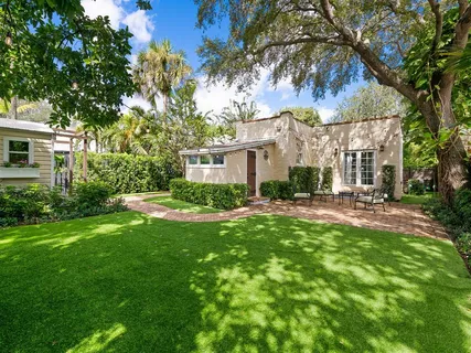 a view of a house with a yard porch and sitting area