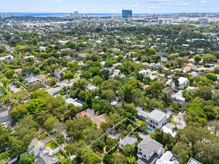 an aerial view of a houses with a city