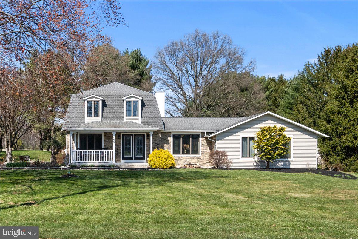 40 New Freedom Road Monroeville, NJ 08343 - Photo 1 of 51 a front view of a house with a garden and trees