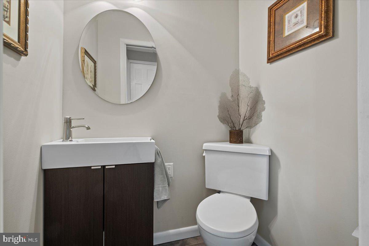 40 New Freedom Road Monroeville, NJ 08343 - Photo 18 of 51 a bathroom with a toilet a sink and mirror