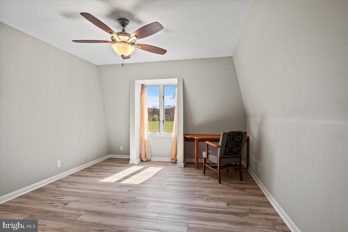 40 New Freedom Road Monroeville, NJ 08343 - Photo 27 of 51 a view of work space with wooden floor and a ceiling fan