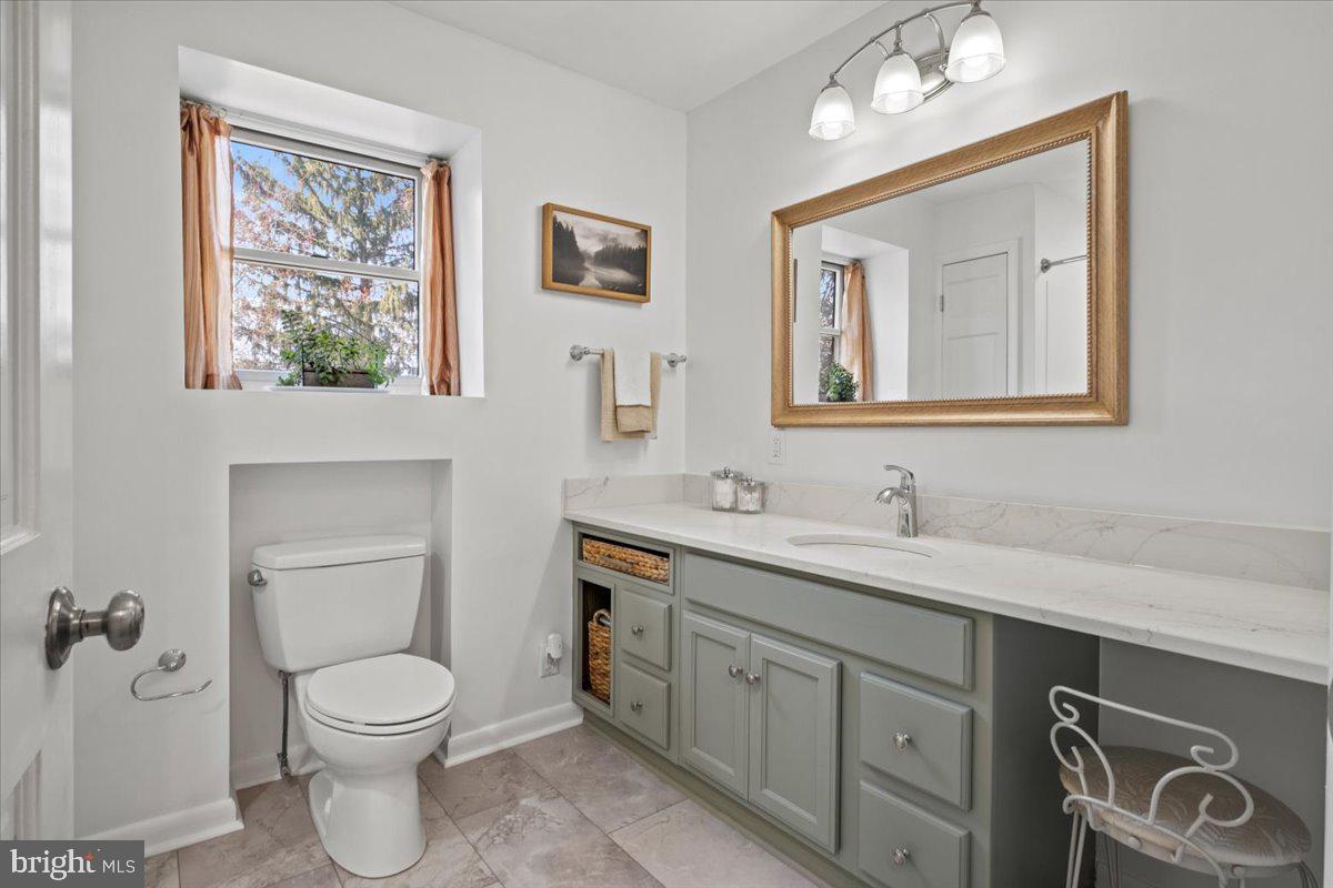 40 New Freedom Road Monroeville, NJ 08343 - Photo 29 of 51 a bathroom with a toilet a sink and mirror