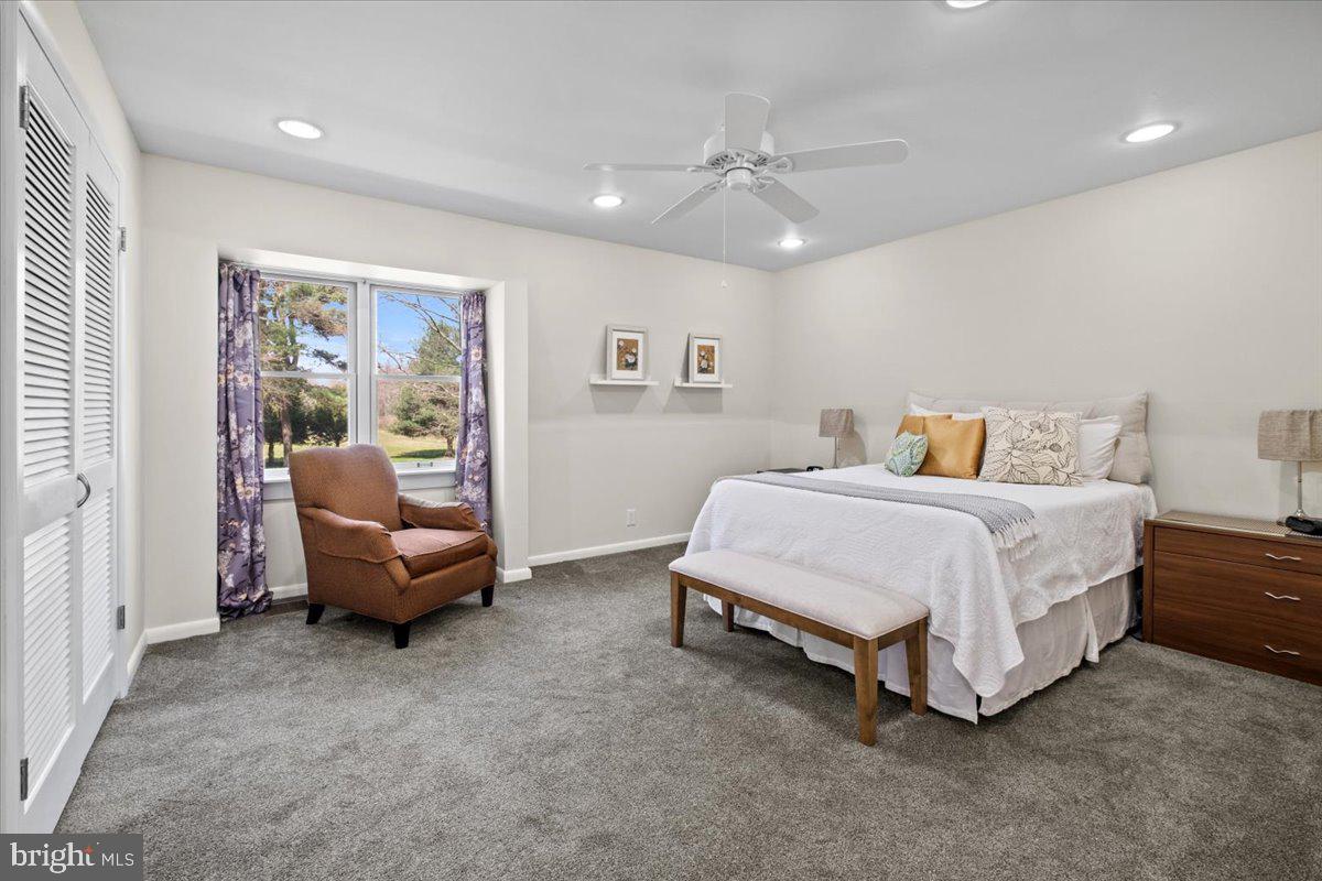 40 New Freedom Road Monroeville, NJ 08343 - Photo 31 of 51 a spacious bedroom with a bed and a couch