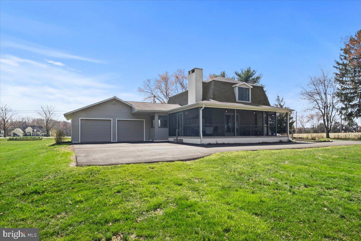 40 New Freedom Road Monroeville, NJ 08343 - Photo 43 of 51 a front view of a house with a yard and garage