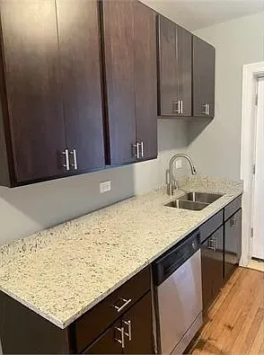a kitchen with a sink and cabinets