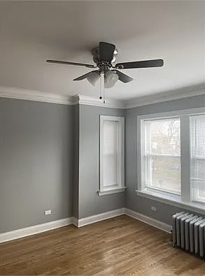 4501 West Maypole Avenue Chicago, IL 60624 - Photo 7 of 13 a view of a livingroom with a ceiling fan and window
