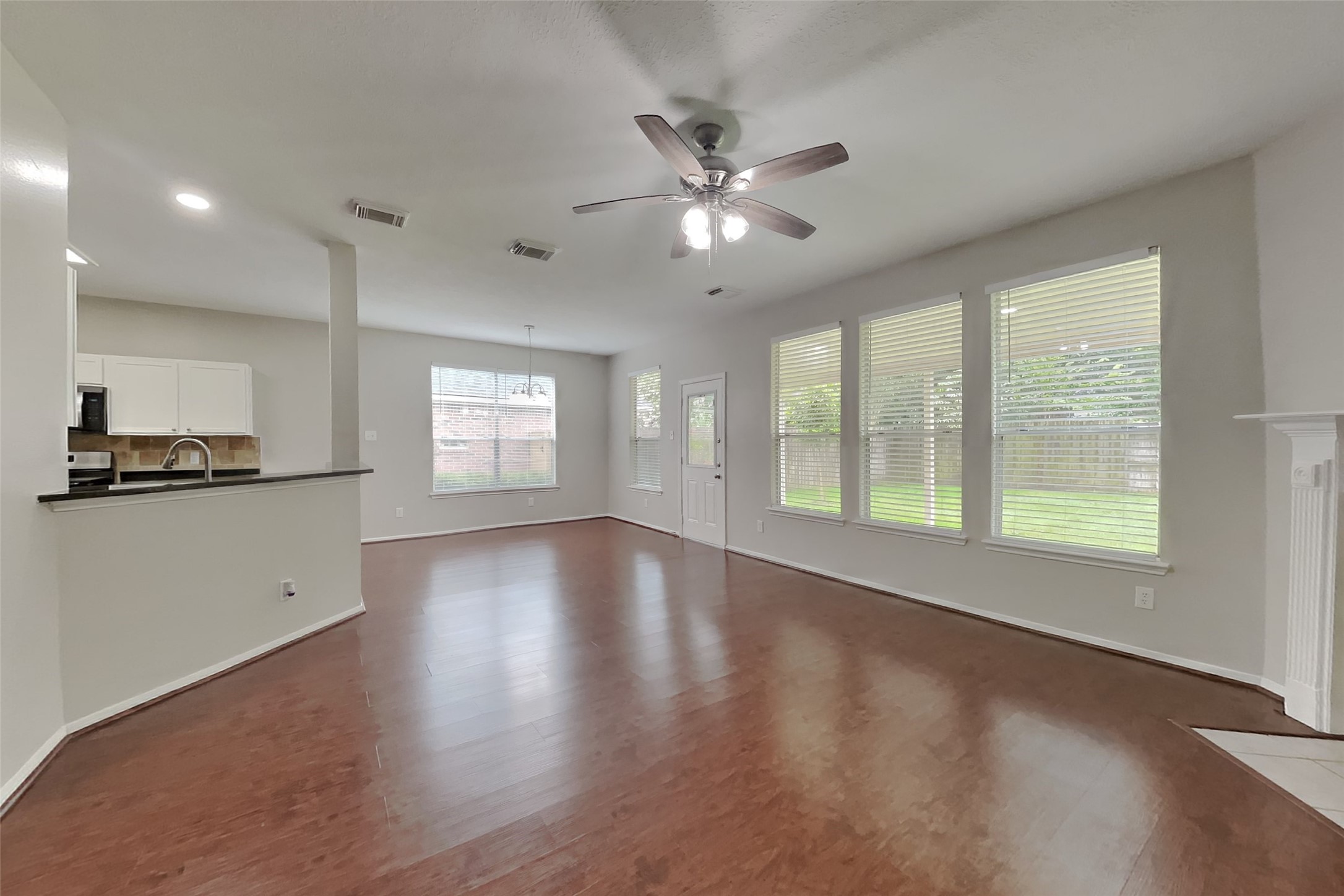 619 Bending Bough Drive Spring, TX 77388 - Photo 3 of 22 a view of an empty room with window and wooden floor