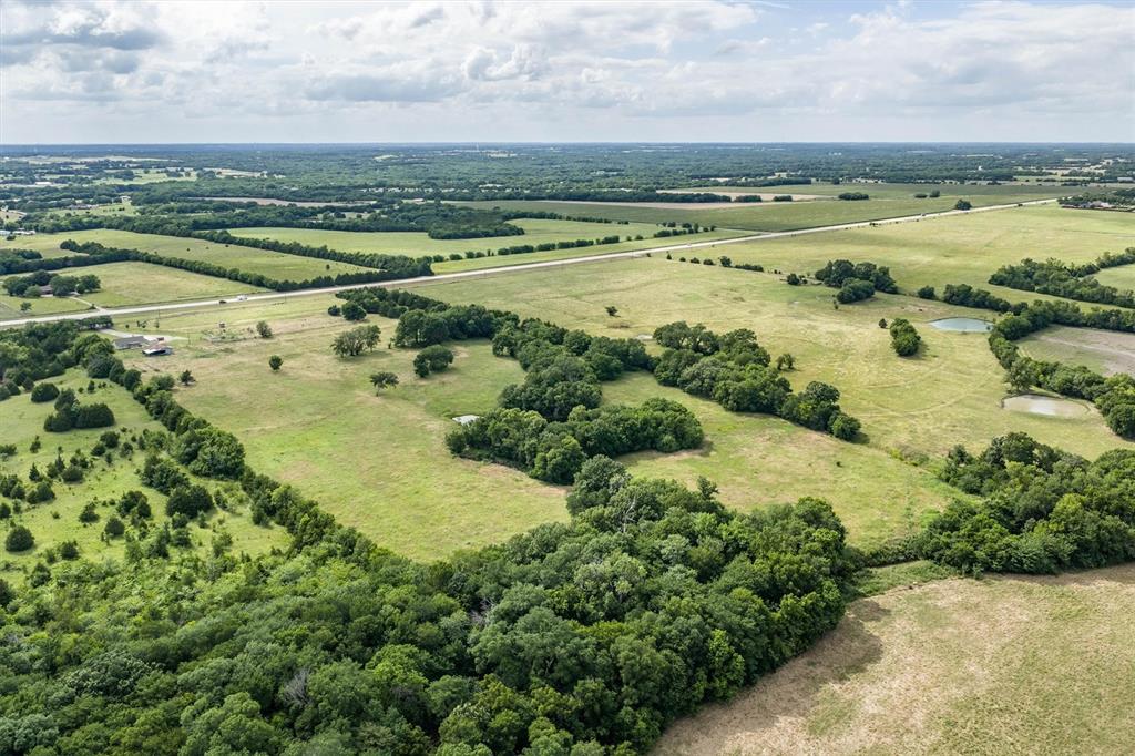 13132 Highway 78 Blue Ridge, TX 75424 - Photo 34 of 35 Expansive land parcel featuring open fields, wooded areas, and two ponds