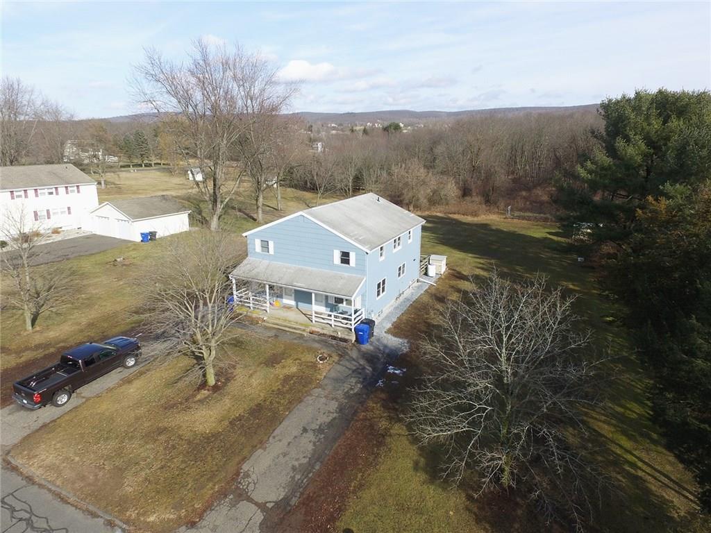 a view of a houses with a yard