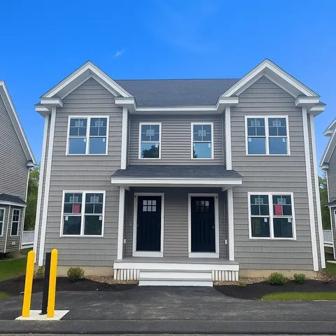 a front view of a house with glass windows