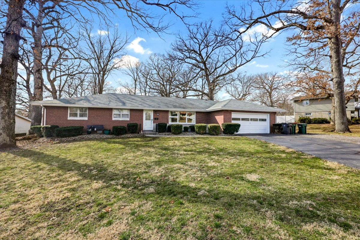3323 Dell Oak Drive Decatur, IL 62526 - Photo 1 of 32 a front view of a building with a yard