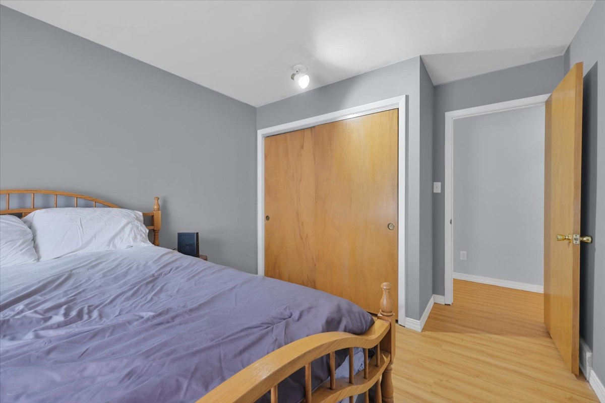 3323 Dell Oak Drive Decatur, IL 62526 - Photo 16 of 32 a bedroom with a bed and wooden floor