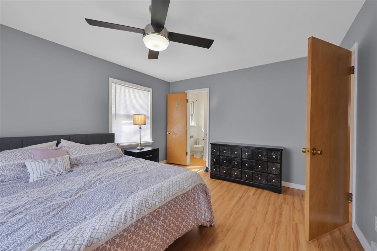 3323 Dell Oak Drive Decatur, IL 62526 - Photo 19 of 32 a bedroom with a bed and dresser with mirror