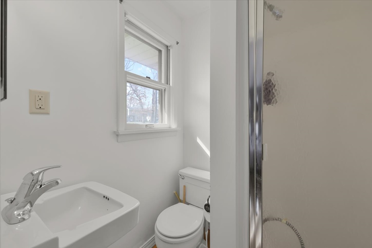 3323 Dell Oak Drive Decatur, IL 62526 - Photo 21 of 32 a white toilet sitting next to a bathroom sink