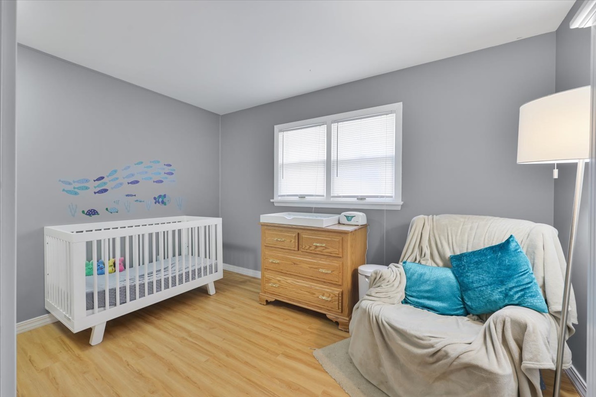 3323 Dell Oak Drive Decatur, IL 62526 - Photo 24 of 32 a bedroom with a bed and a couch