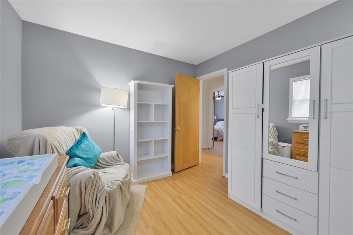 3323 Dell Oak Drive Decatur, IL 62526 - Photo 25 of 32 a bedroom with a bed and wooden floor