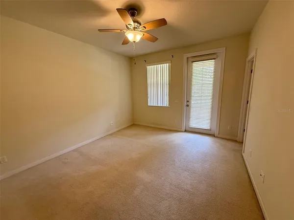 a view of an empty room with a window