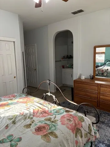 a bedroom with a bed and a window