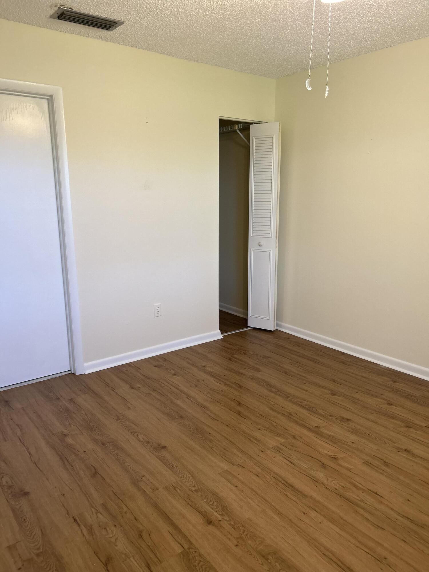 1923 Southwest Palm City Road, Unit G Stuart, FL 34994 - Photo 18 of 26 Primary Bedroom