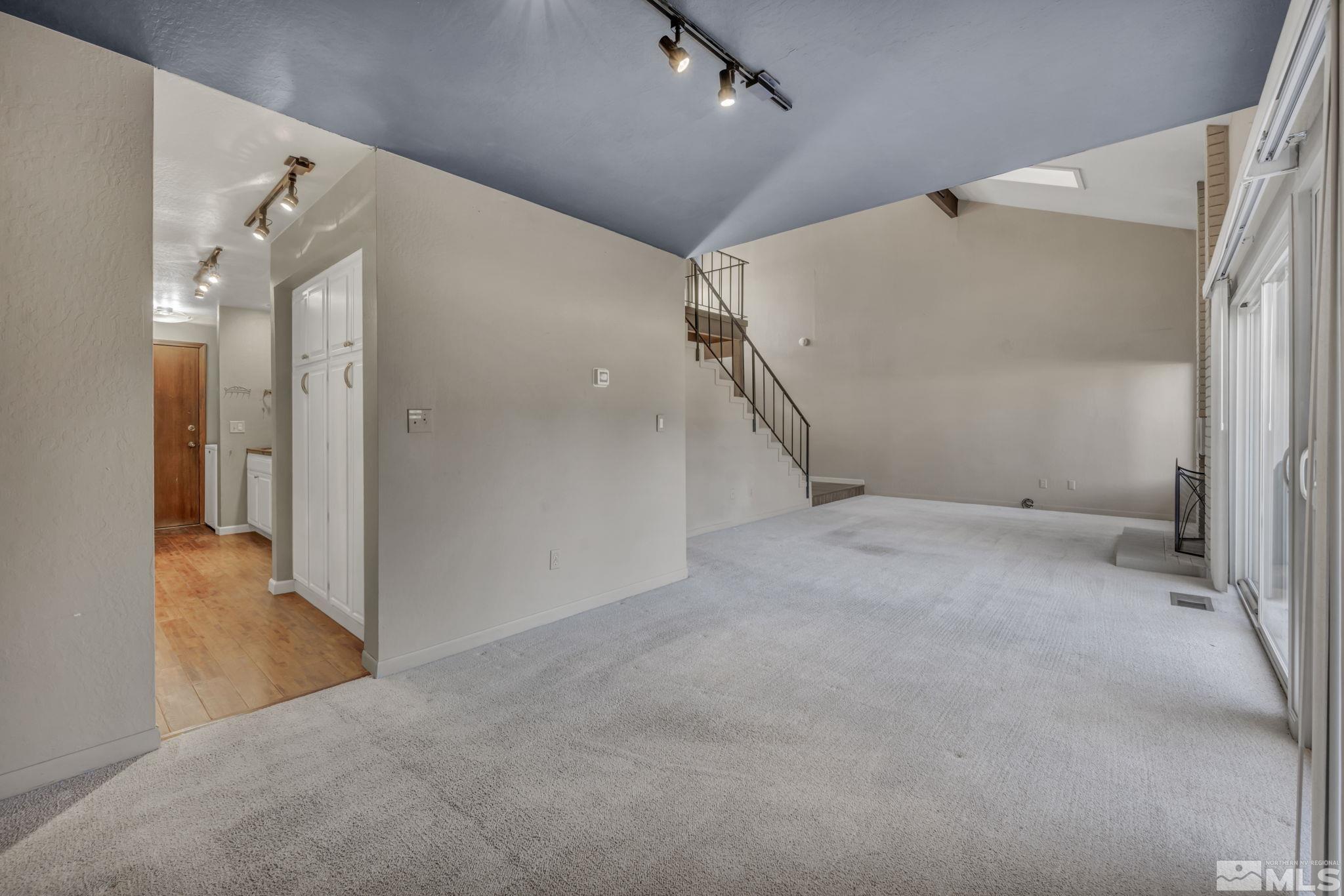 4311 Clyde Court Reno, NV 89509 - Photo 15 of 40 an empty room with a white walls and door