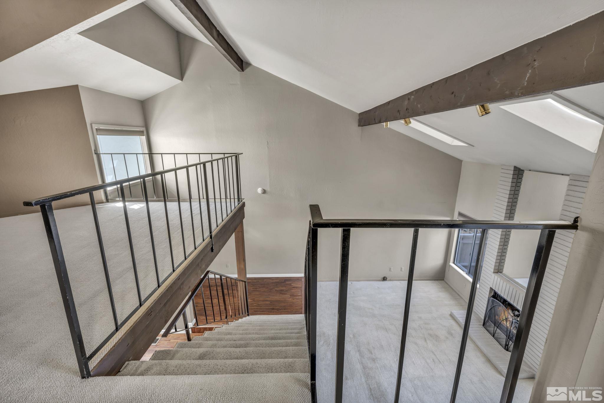 4311 Clyde Court Reno, NV 89509 - Photo 16 of 40 a view of staircase with railing and white walls