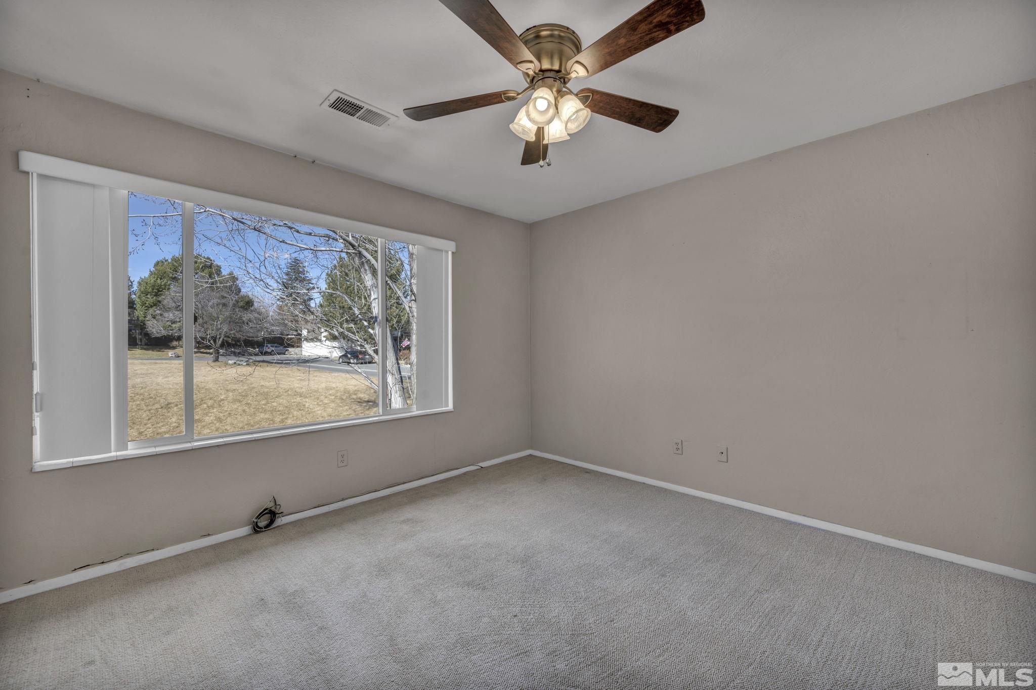 4311 Clyde Court Reno, NV 89509 - Photo 22 of 40 an empty room with windows and fan