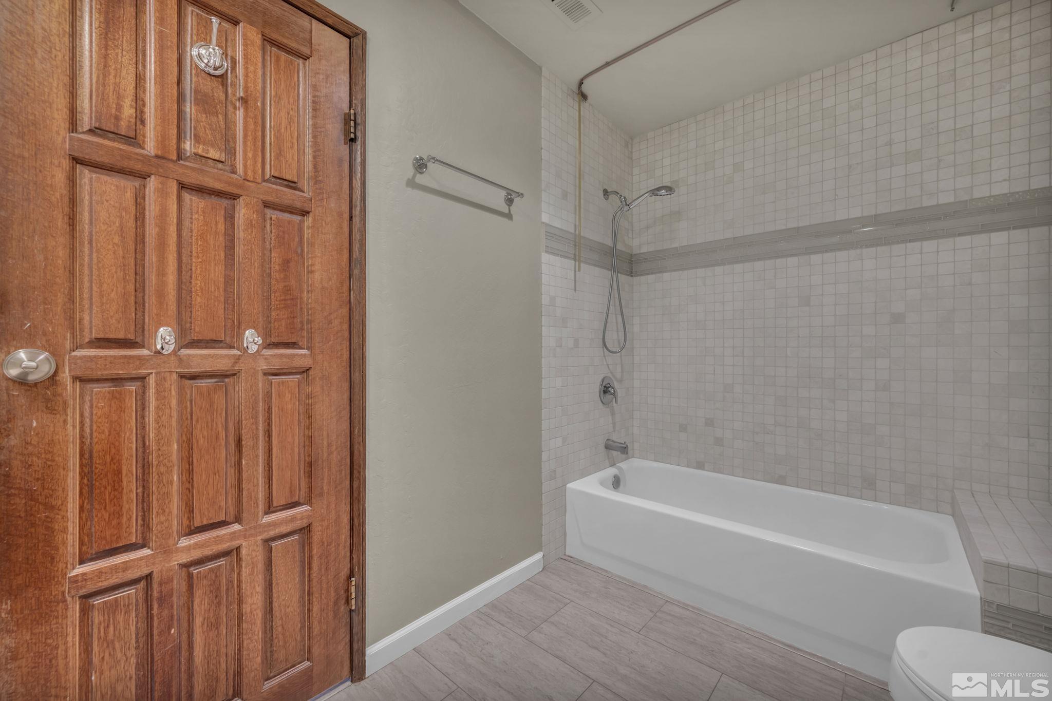 4311 Clyde Court Reno, NV 89509 - Photo 26 of 40 a bathroom with a bathtub