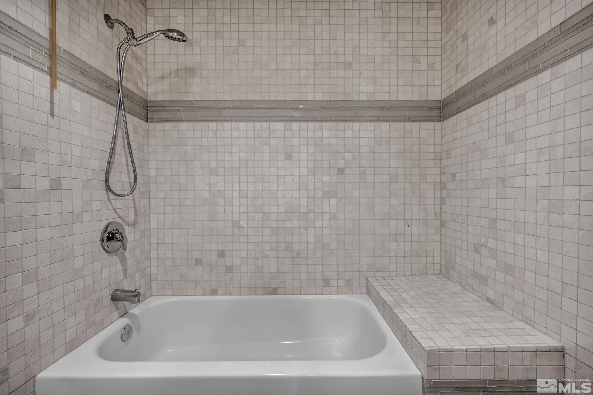 4311 Clyde Court Reno, NV 89509 - Photo 27 of 40 a bathroom with a shower and a bathtub