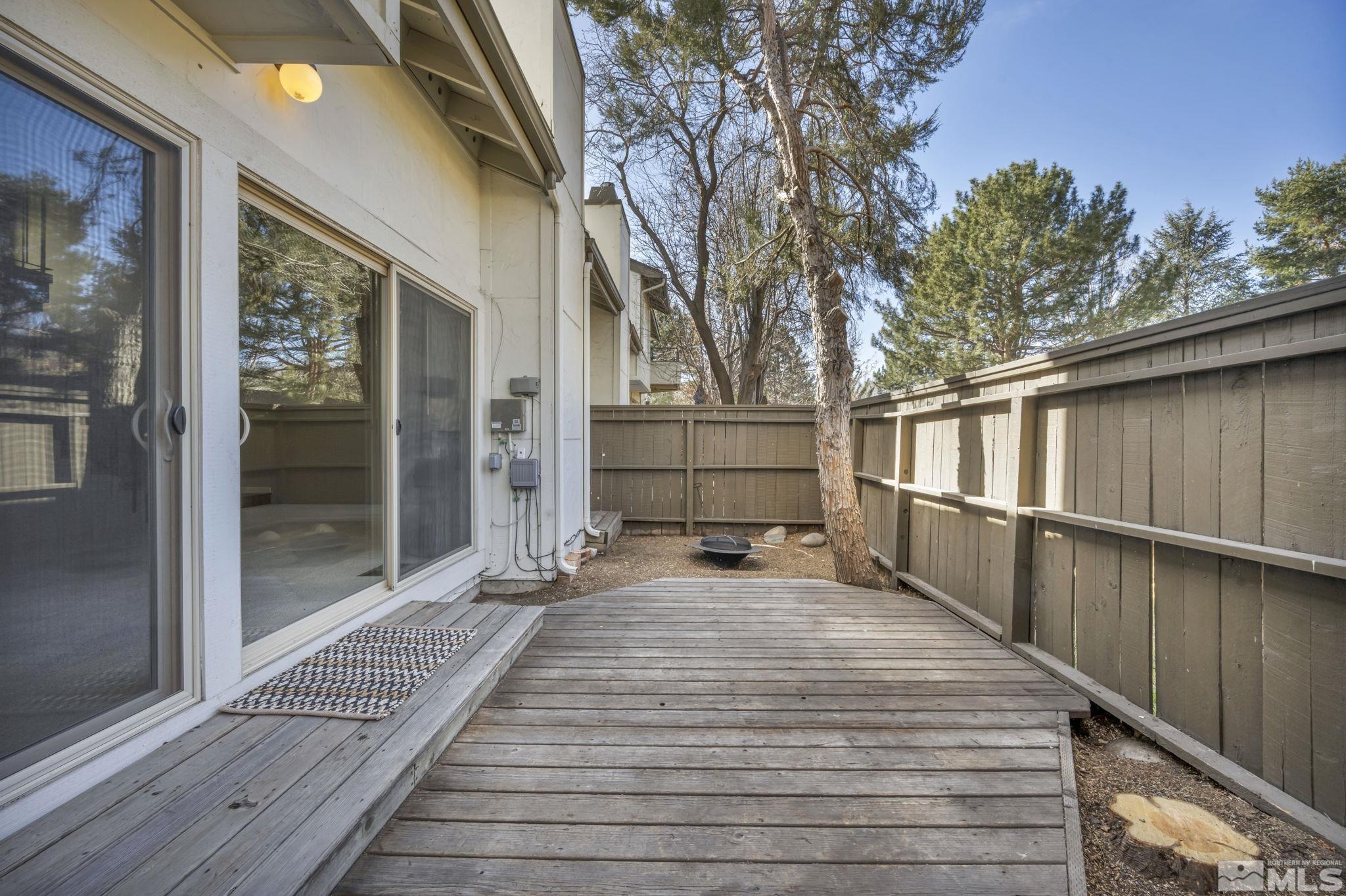 4311 Clyde Court Reno, NV 89509 - Photo 31 of 40 a view of a balcony with wooden floor and large tree