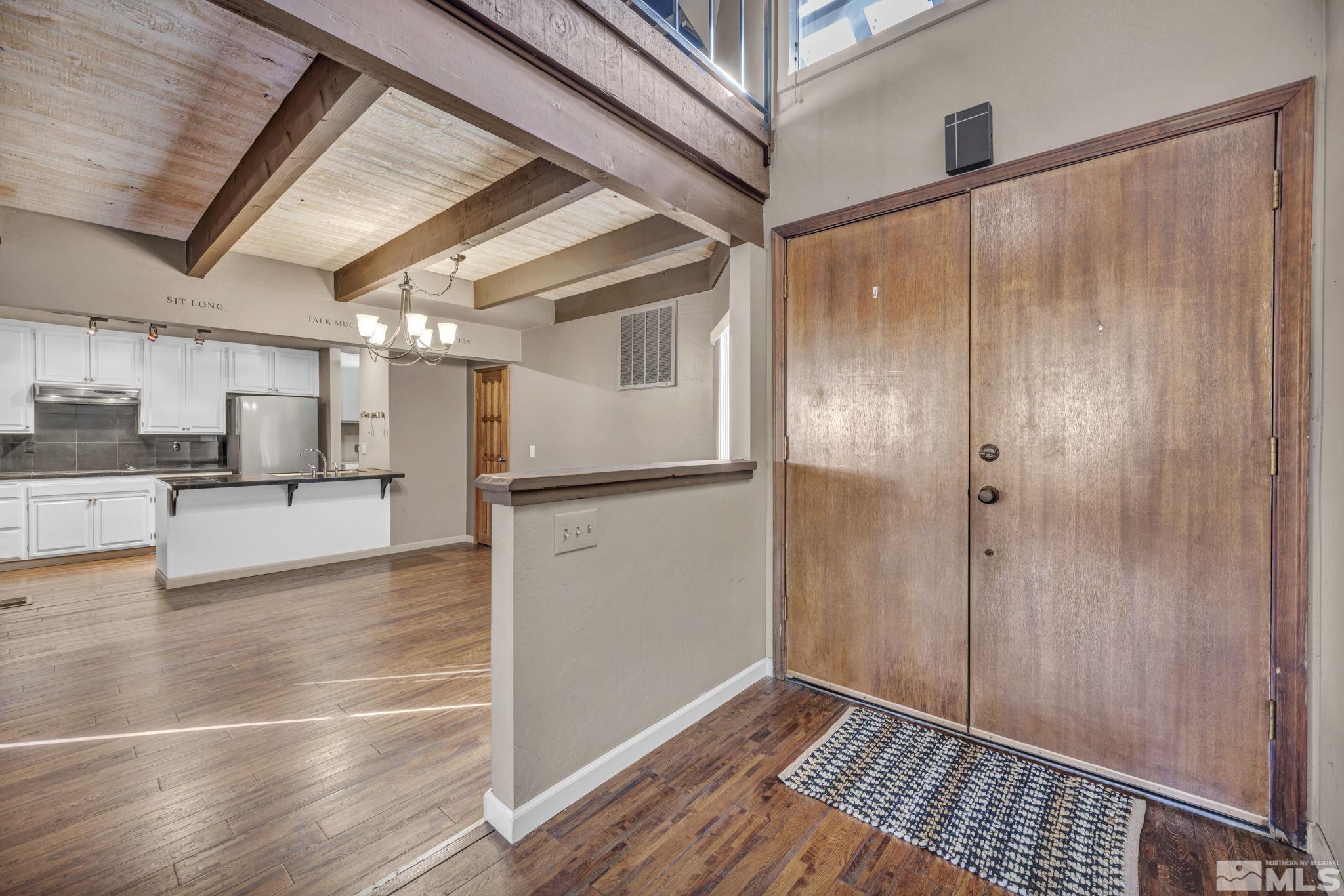 4311 Clyde Court Reno, NV 89509 - Photo 5 of 40 a view of a hallway with wooden floor